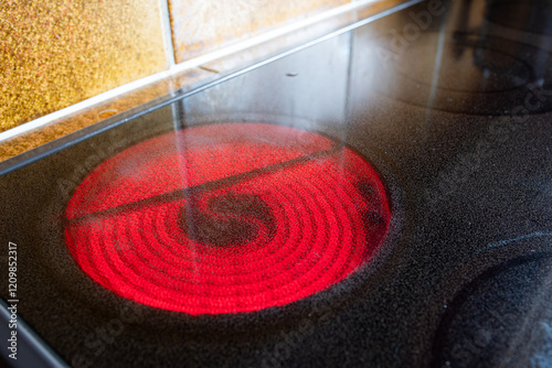 Electric induction stove red-hot glowing element, Close up shot, no people