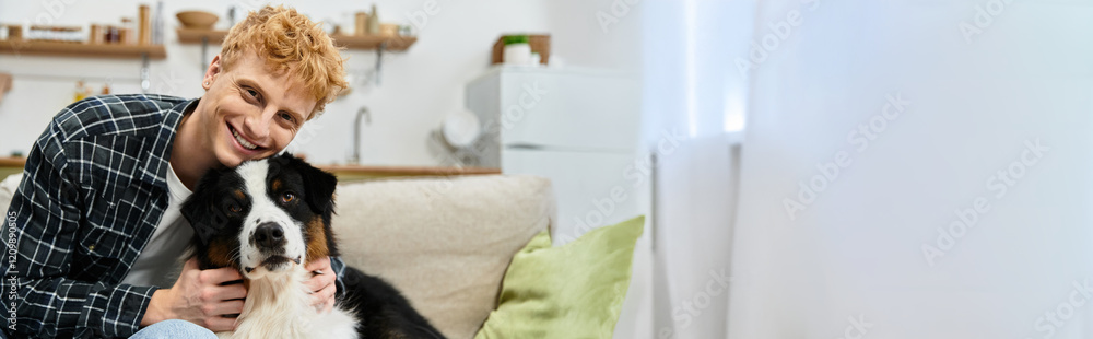 In a sleek apartment, a young redhead cuddles his cute Aussie Shepherd, enjoying happy moments, banner In a sleek apartment, a young redhead cuddles his cute Aussie Shepherd, enjoying happy moments, banner