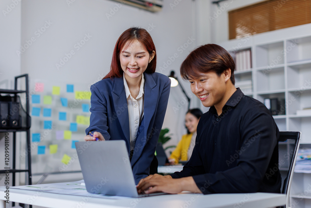 Smiling businessman working on a laptop computer in a modern office,doing finances, accounting analysis, report data pointing graph Freelance education and technology concept. Smiling businessman working on a laptop computer in a modern office,doing finances, accounting analysis, report data pointing graph Freelance education and technology concept.