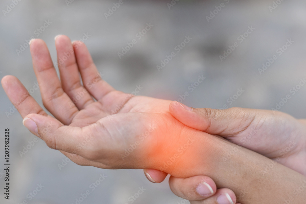 Wrist affected by a medical condition, showing visible signs of inflammation, swelling, or discomfort. Pain, injury, or arthritis, carpal tunnel syndrome, or tendonitis. Wrist affected by a medical condition, showing visible signs of inflammation, swelling, or discomfort. Pain, injury, or arthritis, carpal tunnel syndrome, or tendonitis.