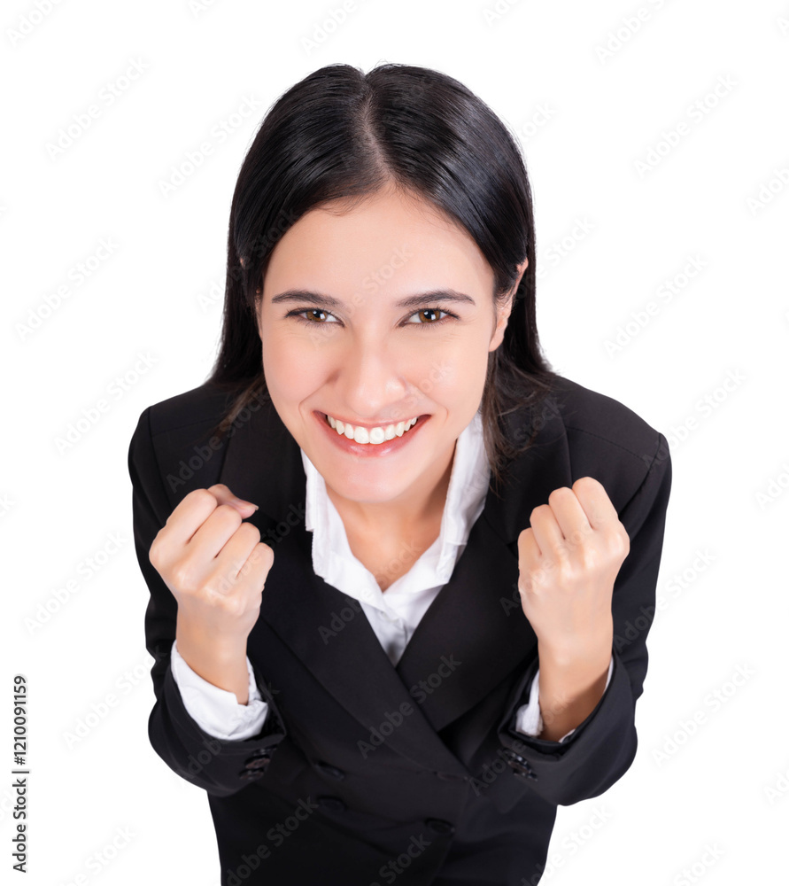 Young woman in black suit, clenching her fists in a celebratory pose with a wide smile. Themes of achievement, success, and motivation in business or personal growth Young businesswoman look at camera Young woman in black suit, clenching her fists in a celebratory pose with a wide smile. Themes of achievement, success, and motivation in business or personal growth Young businesswoman look at camera