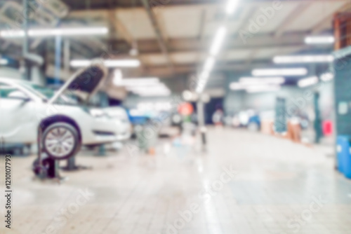 Repair service station with lifted modern cars being under maintenance and technicians on blurred background with many diode lamps. Auto service ,technician and workshop   concept