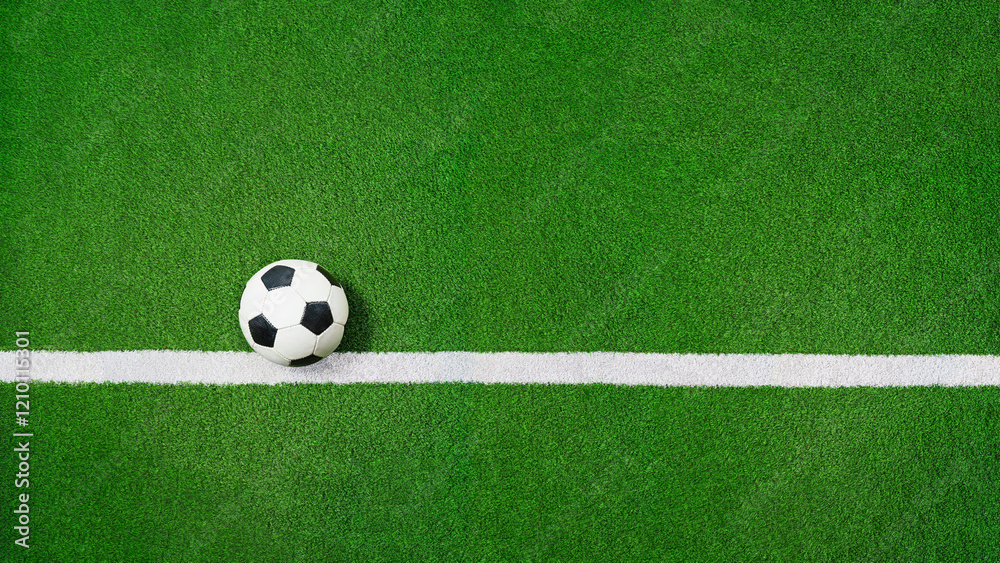 green grass texture with soccer ball on the line - well-groomed turf in the stadium green grass texture with soccer ball on the line - well-groomed turf in the stadium
