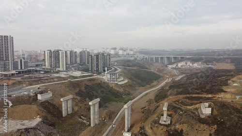 Aerial shot of bridges and buildings within a valley in Istanbul city