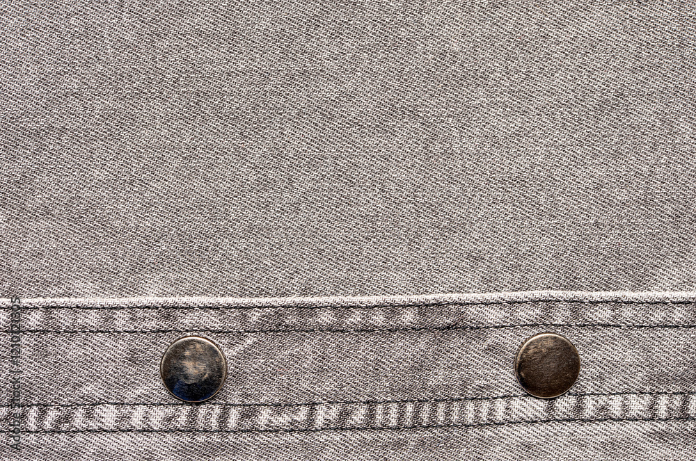 Macro background photography of denim fabric, grey jeans cloth, buttons and seam, fashion, design, textured frame, blank photo Macro background photography of denim fabric, grey jeans cloth, buttons and seam, fashion, design, textured frame, blank photo