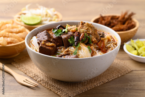 Northern Thai food, Spicy rice noodles soup with pork eating with fresh vegetables, Local Thai food