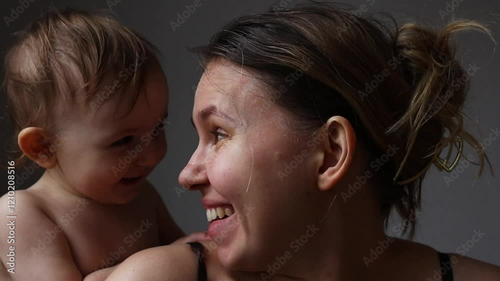 A mom expresses shock as a child playfully sneaks up behind, creating a light-hearted atmosphere filled with joy.