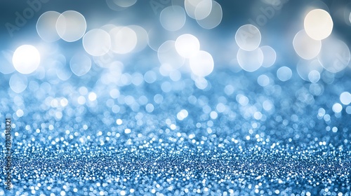A light blue glittery background, shiny and sparkling with tiny silver bokeh lights. 