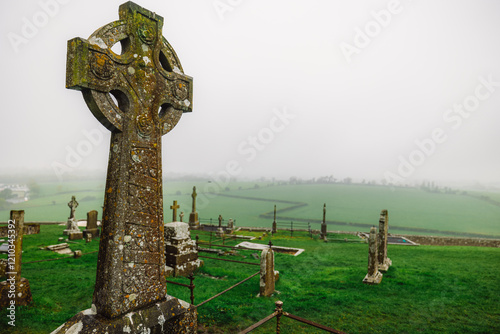 Celtic crosses at Rock of Cashel in Rainy foffy Irish Day , County Tipperary, Ireland photo