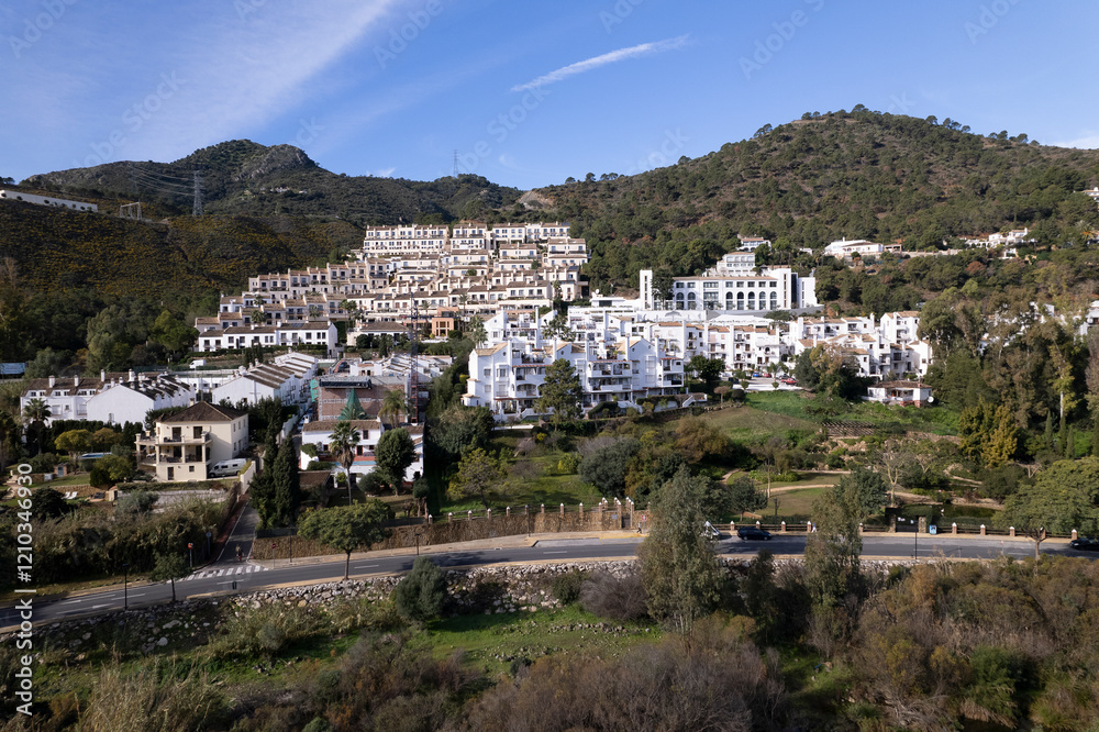 Obraz premium Aerial of mountainais Benahavis village luxury housing along the sun coast