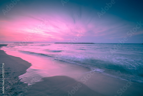 Obraz na płótnie Seascape in the evening. Sunset over the sea with a beautiful dramatic glowing sky w salonie