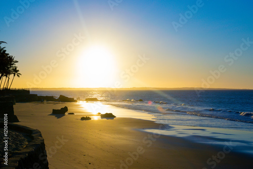 Bright sunset in Paracuru beach, Ceara, Brazil. photo