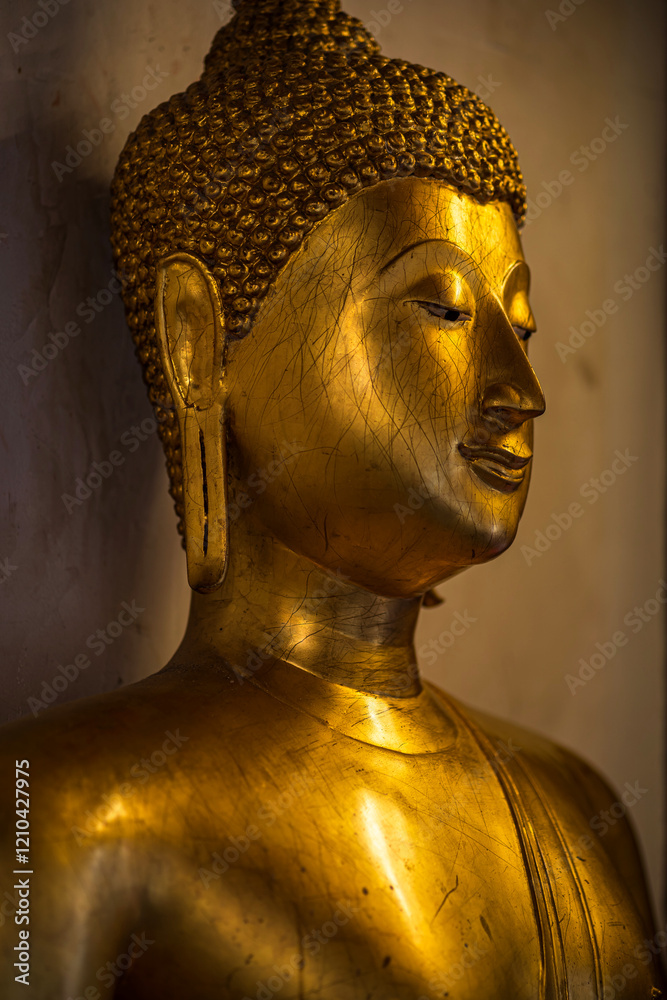 Close-up of Old Beautiful Golden Buddha statues at Wat Phra Si Rattana Mahathat also colloquially referred is a Buddhist temple It is a major tourist is Public places in Phitsanulok,Thailand.
