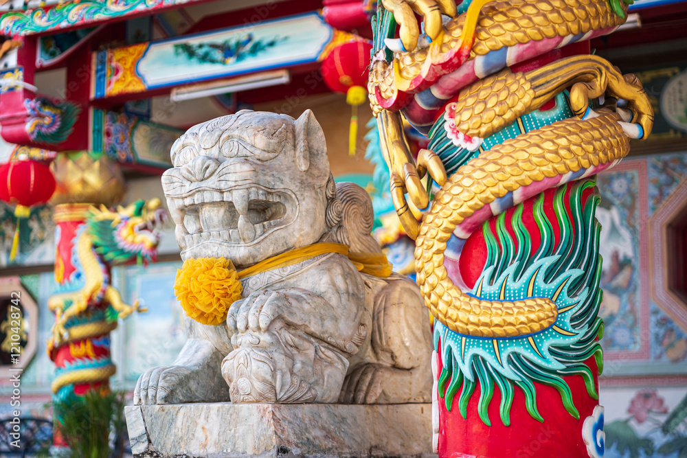 White marble Chinese lion statue in front of Munlanithi Prasatbun Sthan Shrine Is a Chinese shrine Ancient chinese art is the That is a tourist attraction, Phitsanulok Thailand