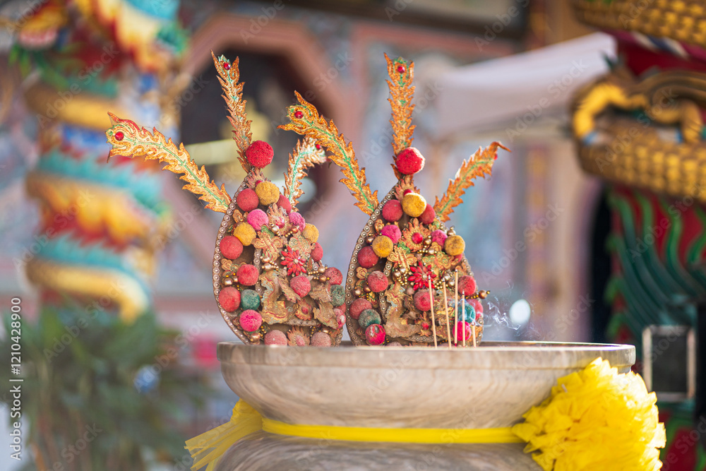 Red candles and burning incense sticks Paper gold with the Chinese alphabet Blessings written on it Is a Fortune blessing compliment for pay respect to god in Chinese New Year day at a Chinese shrine