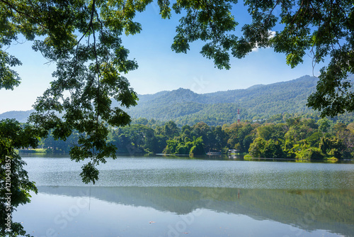 Obraz na płótnie a public place leisure travel landscape lake views at Ang Kaew Chiang Mai University and Doi Suthep nature forest Mountain views spring cloudy sky background with white cloud. w salonie