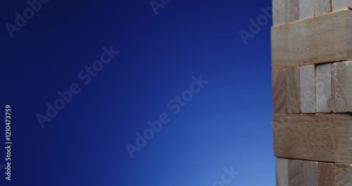 This artwork features an abstract textured wall positioned against a striking deep blue background