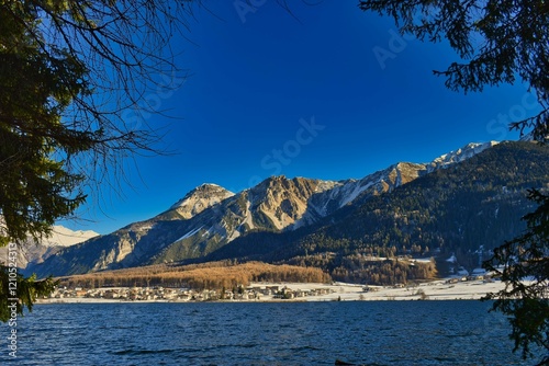 Reschensee im Schnee, Dolomiten, Ortler photo