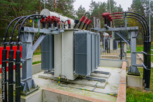 Electrical equipment in outdoor power substation, two three phase oil immersed transformers photo