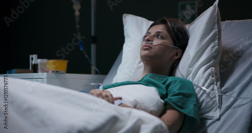 Photos Tired and exhausted female patient in hospital ward recovers after bad accdient