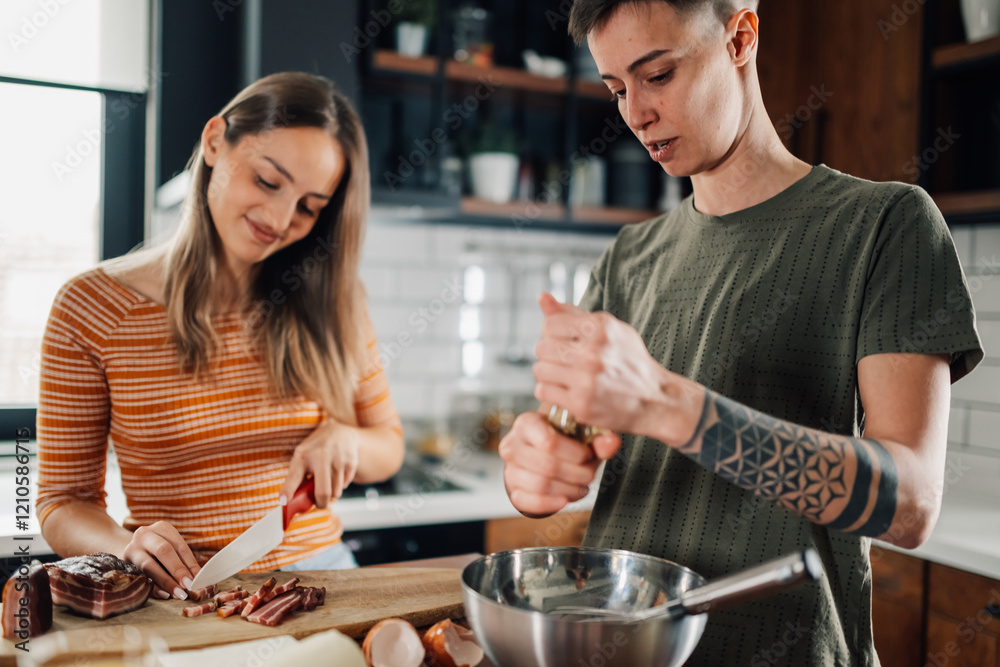 Lesbian couple preparing ingredients for meal in kitchen Lesbian couple preparing ingredients for meal in kitchen