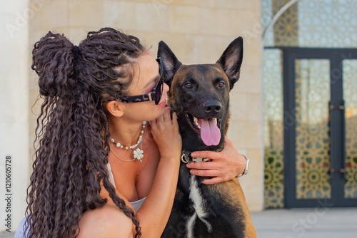 one Girl sitting with a Malinois dog