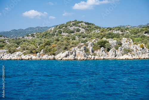 Fototapeta Naklejka Na Ścianę i Meble -  Beautiful bay near Kekova island and Kas in Antalya province, Türkiye. Sunny summer in seaside. Turquoise water