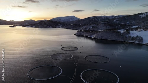 Aerial view from a drone flying across the calm waters of Kvernes fjord towards Gullset point photo