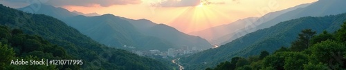 Misty dawn breaks through mountains covered with lush green forests, Mugla province, Turkish Riviera, landscape