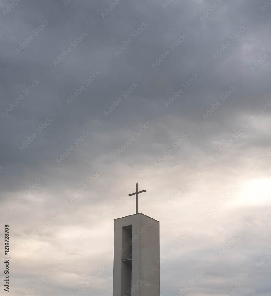 Christian cross on a roof with a dramatic background Christian cross on a roof with a dramatic background