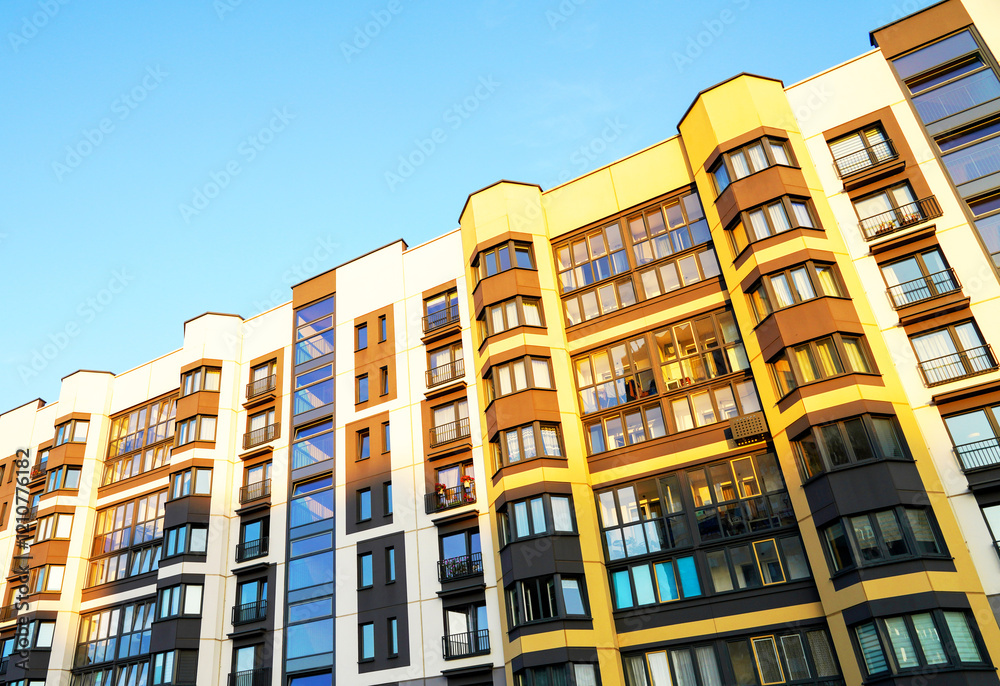 Fototapeta premium Residential condominium building. Modern complex of Apartment residential condo. Residential architecture exterior. Modern facade building. New House, Eco-friendly residential building.