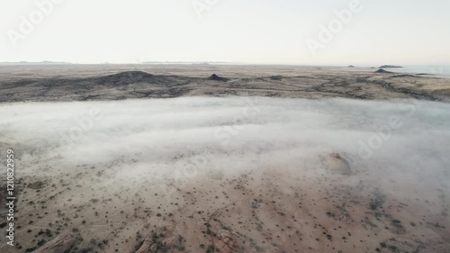 Foggy Morning Over Rocky Landscape in African Desert