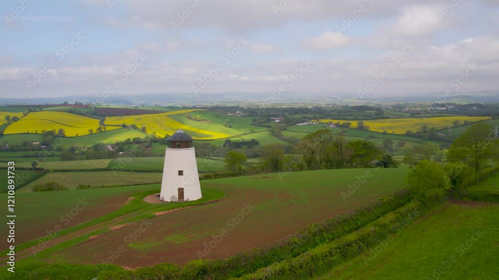 Windmill over fields and farms from a drone, Torquay, Devon, England Windmill over fields and farms from a drone, Torquay, Devon, England