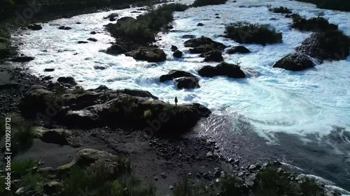 Rushing River with Rocks and Lush Vegetation