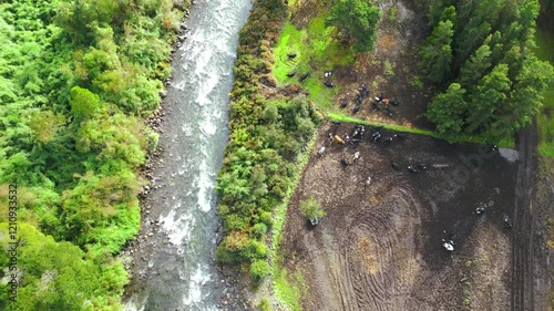 Aerial View of Riverbank with Farmland and Forest