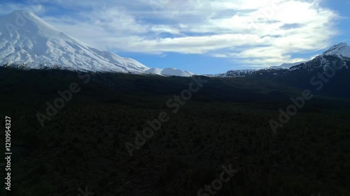Snow-Capped Mountains Under a Dramatic Sky