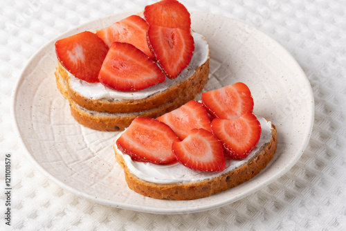 Homemade Crispbread toast with Cottage Cheese and Strawberry on white table
