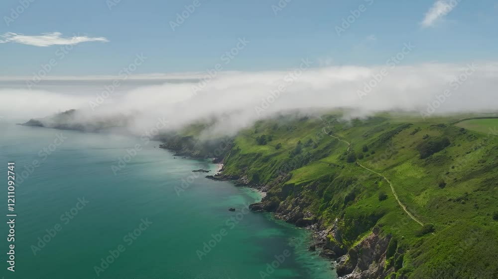 Sea Fret over Cliffs and Start Point Lighthouse from a drone, Trinity House and South West Coast Path, Devon, England Sea Fret over Cliffs and Start Point Lighthouse from a drone, Trinity House and South West Coast Path, Devon, England