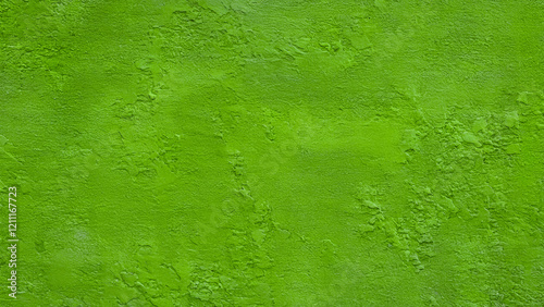 A textured surface that appears to be a green wall or surface. The texture is rough and uneven, with numerous small indentations and irregularities
