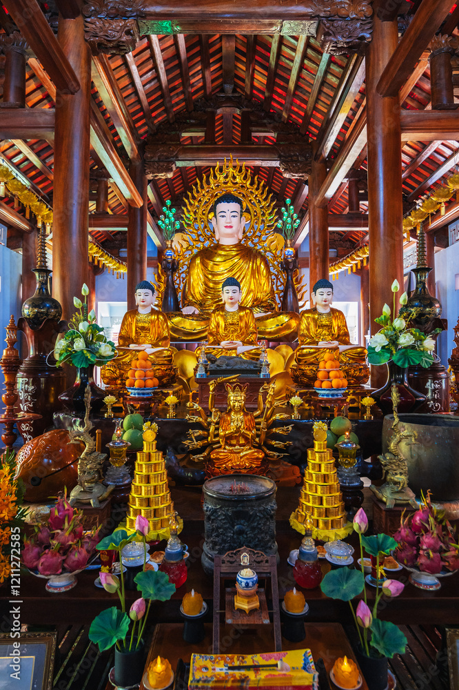 There are many Buddhist golden Buddha statues inside a temple in a pagoda in Nha Trang, Asia There are many Buddhist golden Buddha statues inside a temple in a pagoda in Nha Trang, Asia
