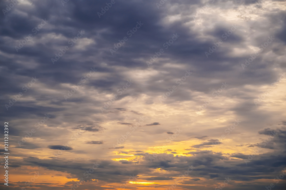 Obraz premium blue clouds against an orange sky at dawn in the morning