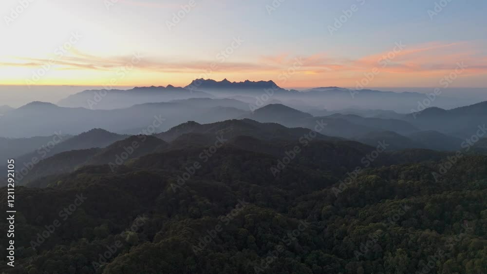 Aerial view foggy mountain forest landscape with morning colorful sunrise sky. (Doi Luang Chiang Dao) thailand . nature background. Aerial view foggy mountain forest landscape with morning colorful sunrise sky. (Doi Luang Chiang Dao) thailand . nature background.