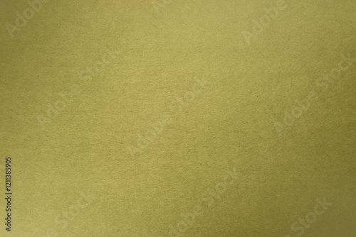 Bright olive green tone color paint on blank recycled cardboard box paper texture background with space minimal style 
