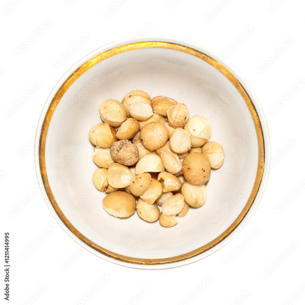 Macadamia nuts peeled on a white background.Macadamia nuts from Australia.Macadamia is a genus of woody plants in the Proteaceae family. Macadamia nuts peeled on a white background.Macadamia nuts from Australia.Macadamia is a genus of woody plants in the Proteaceae family.