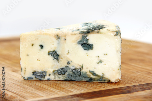 FRONT GORGONZOLA CHEESE ON ISOLATED WOODEN BACKGROUND