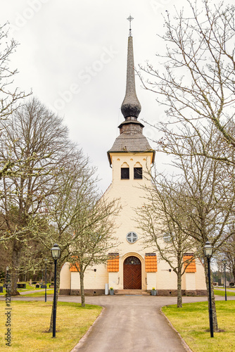 Walkway with trees to a church photo