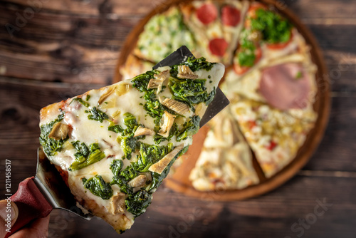 Fototapeta Naklejka Na Ścianę i Meble -  Assorted handmade Argentinian pizza on wooden background