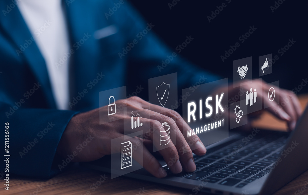 Fototapeta premium Risk management strategy concept. A businessman use laptop analyzing, a risk management interface with critical strategy. Risky business risk management control and strategy. Stability unforeseen.