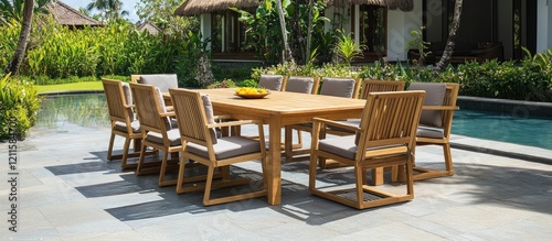 Bamboo outdoor dining set featuring a natural wood finish positioned around a rectangular table with comfortable grey cushions in a serene garden setting.