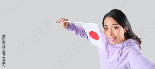 Beautiful Asian woman holdi...